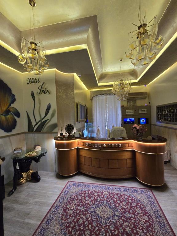 a lobby with a reception desk in a building at Hotel Iris in Naples