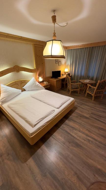 Voodi või voodid majutusasutuse Hotel Alpenrose toas