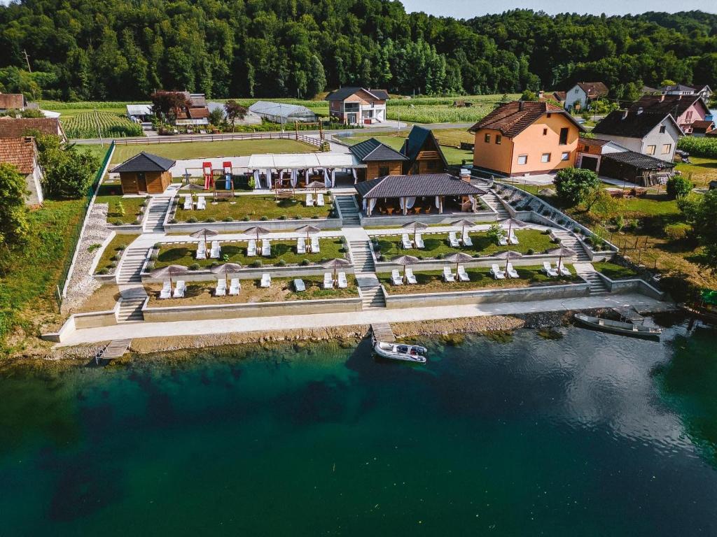 an aerial view of a resort on a river at Una Relax in Bosanski Novi