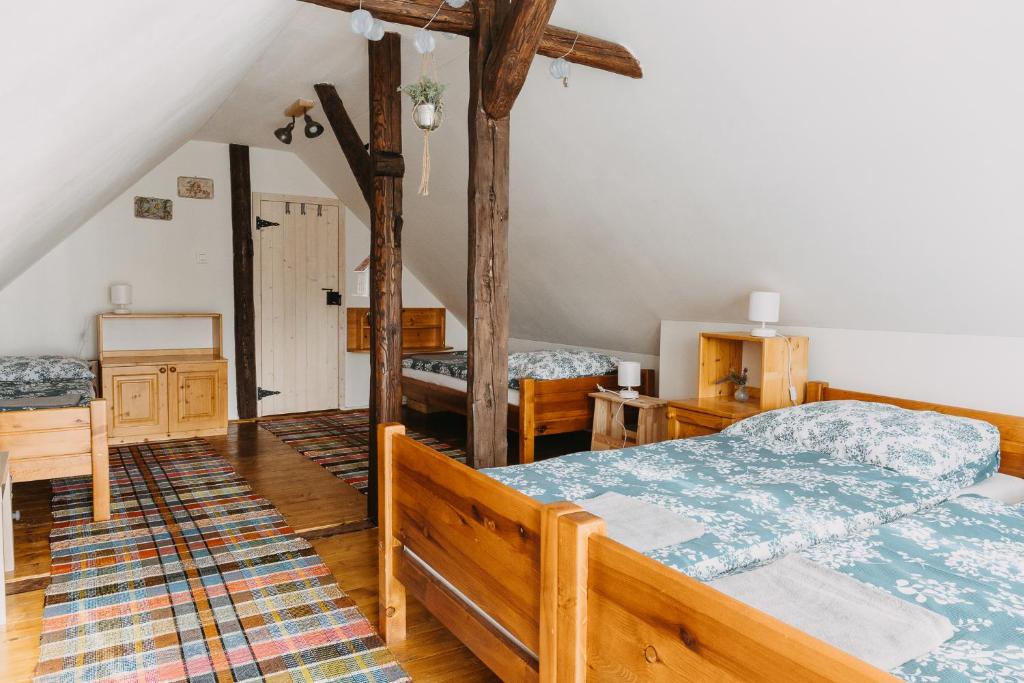 a bedroom with two beds in a attic at DREVENICA in Hrabušice