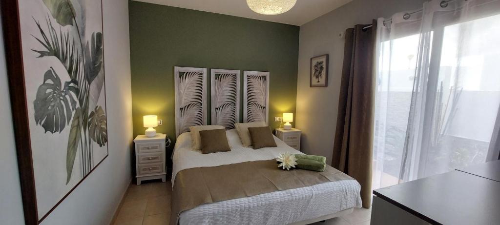 A bed or beds in a room at Villa Del Corazon Salinas Golf