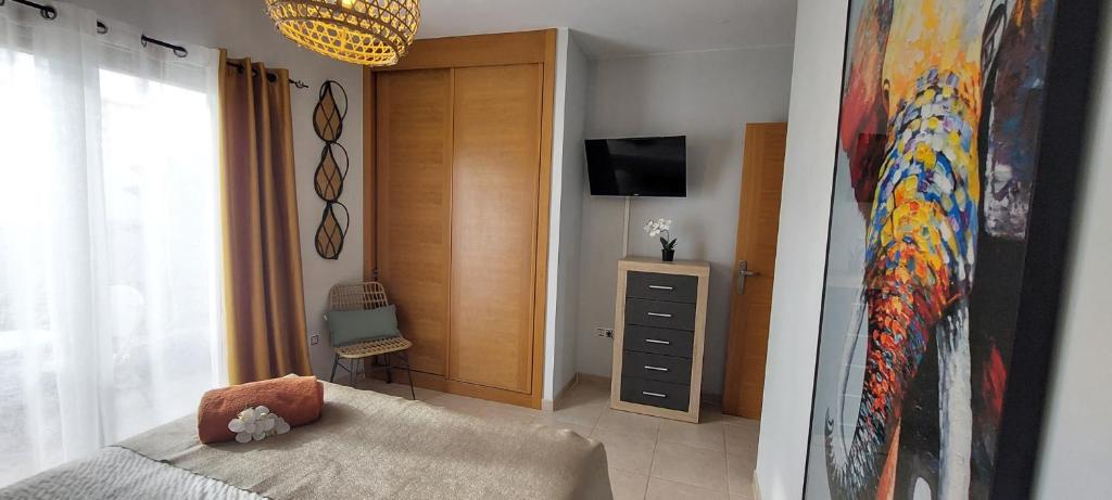 A television and/or entertainment centre at Villa Del Corazon Salinas Golf