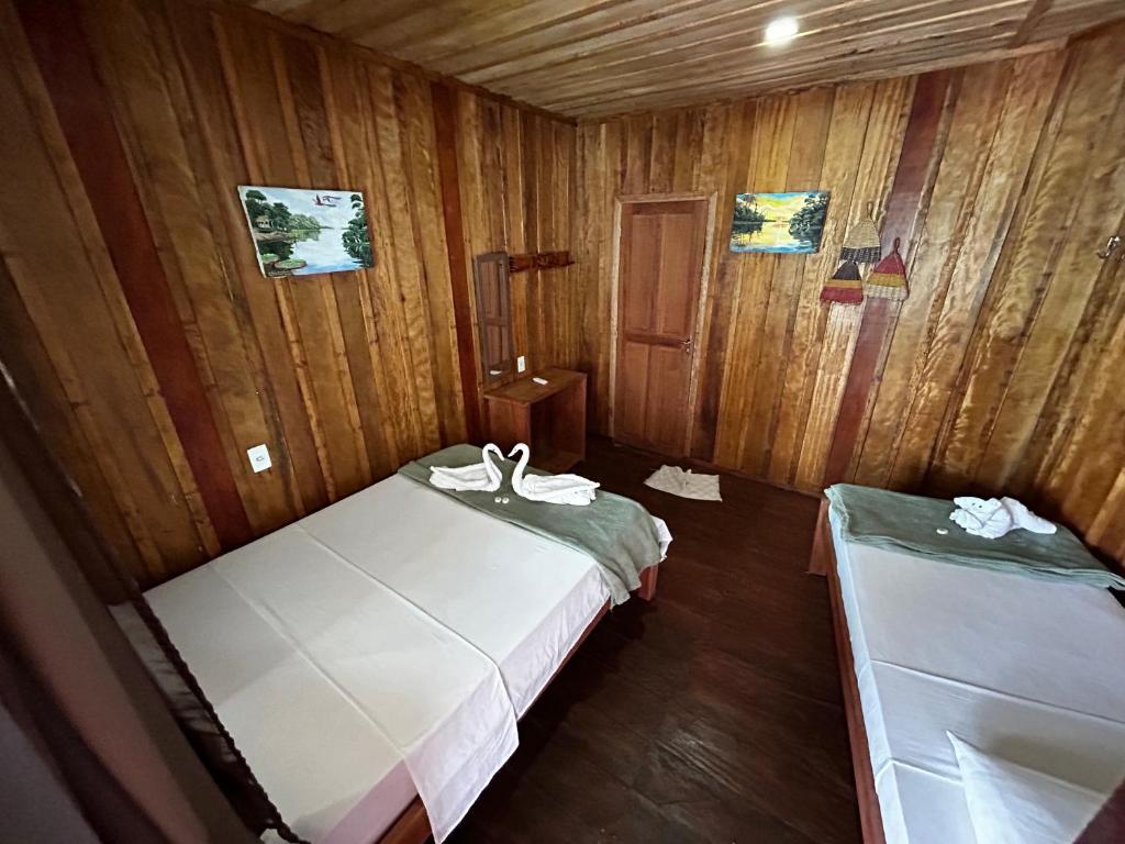 Postel nebo postele na pokoji v ubytování Vista do Lago Jungle Lodge