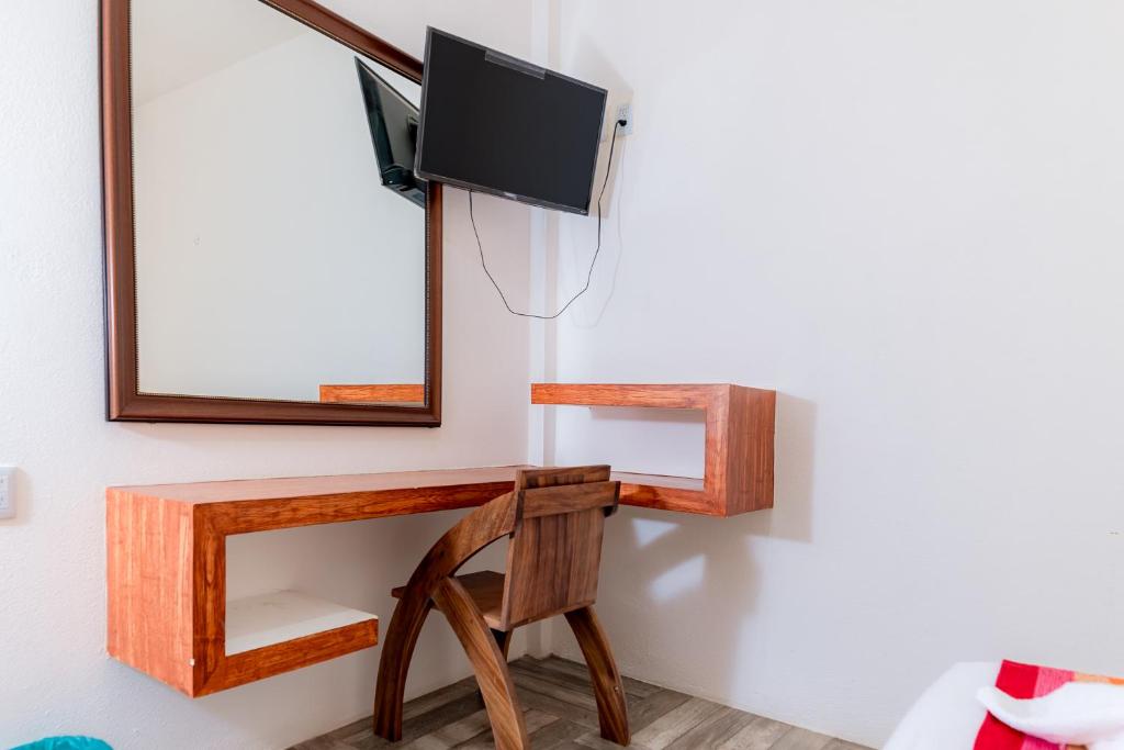 TV a/nebo společenská místnost v ubytování Hotel Axolotl