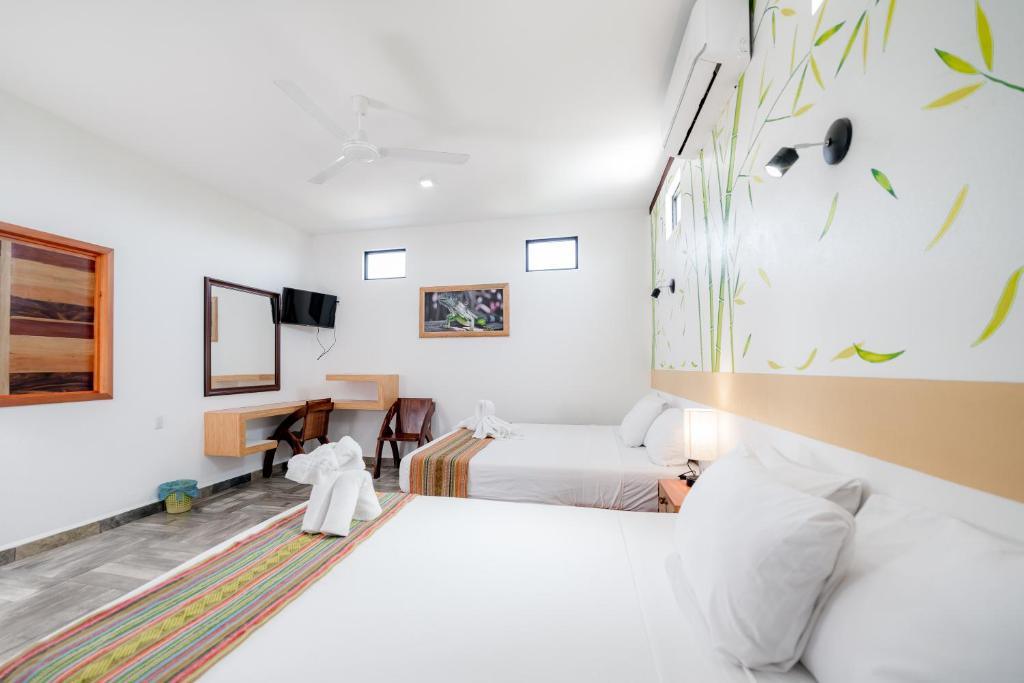 Postel nebo postele na pokoji v ubytování Hotel Axolotl