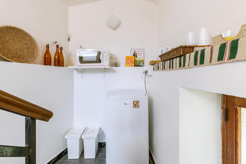 Kuchyň nebo kuchyňský kout v ubytování Giaminera Rooms & Art Studio