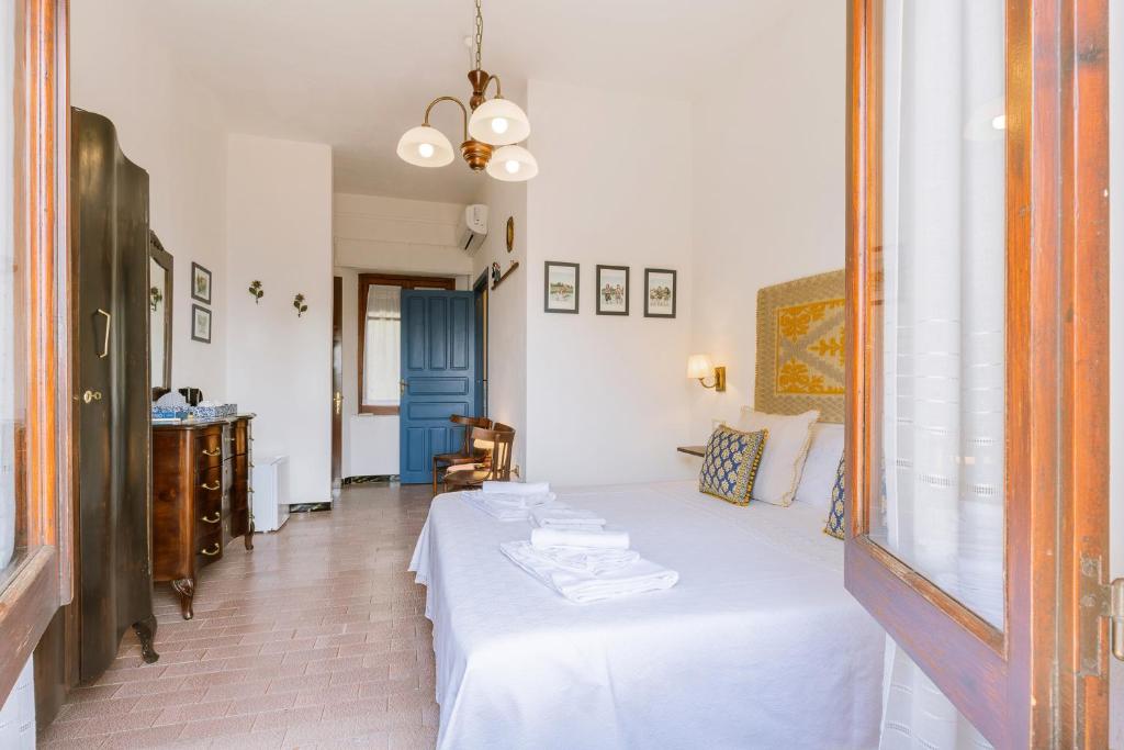 Postel nebo postele na pokoji v ubytování Giaminera Rooms & Art Studio