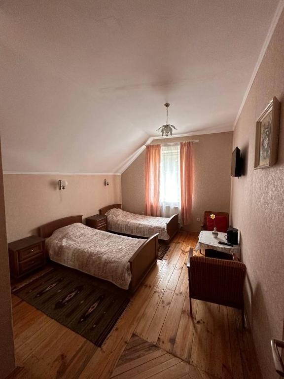 Postel nebo postele na pokoji v ubytování Роксолана