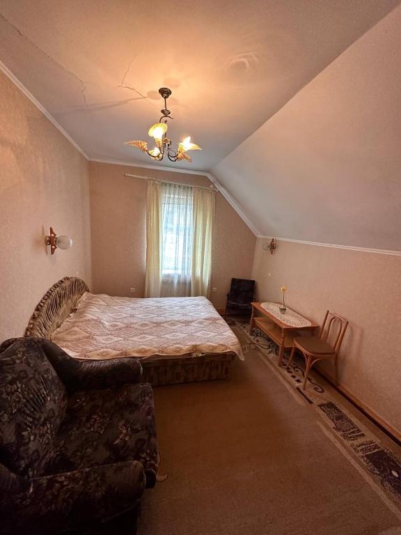 Postel nebo postele na pokoji v ubytování Роксолана
