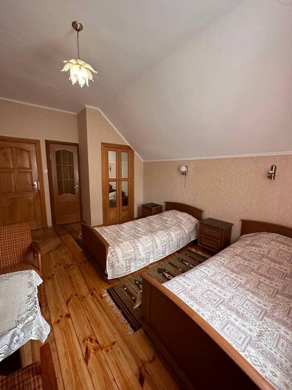 Postel nebo postele na pokoji v ubytování Роксолана