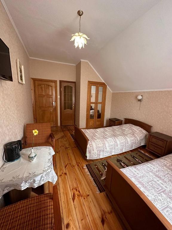 Postel nebo postele na pokoji v ubytování Роксолана