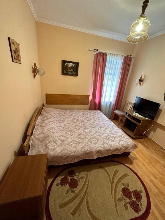 Postel nebo postele na pokoji v ubytování Роксолана