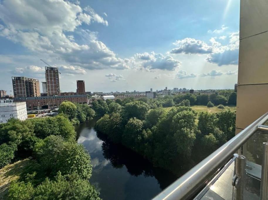 a view of a river in a city at Chic 1 Bed MCR Ap w/Balcony- Sleeps 4 in Manchester