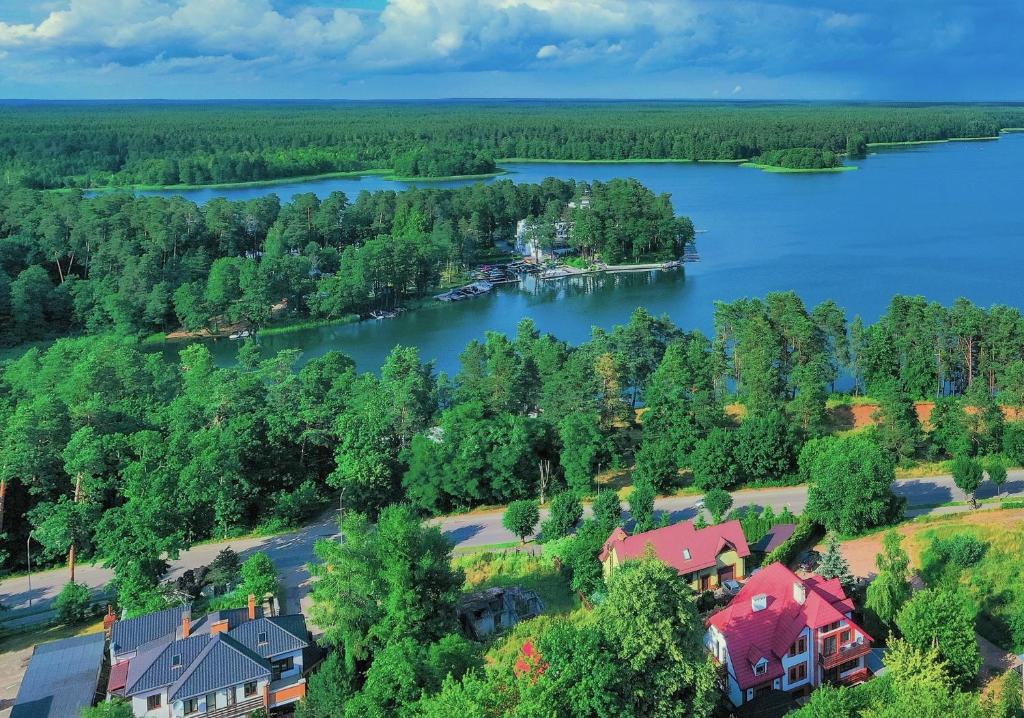 an aerial view of a house on the shore of a lake at Willa Polanica in Augustów