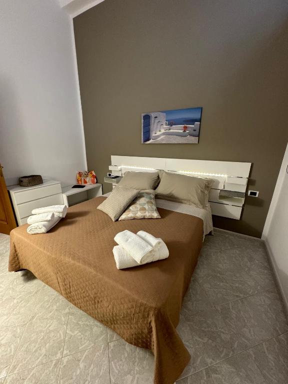 Łóżko lub łóżka w pokoju w obiekcie Cavour Holidays