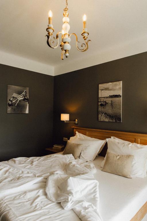 Postel nebo postele na pokoji v ubytování Hotel Villa Rainer