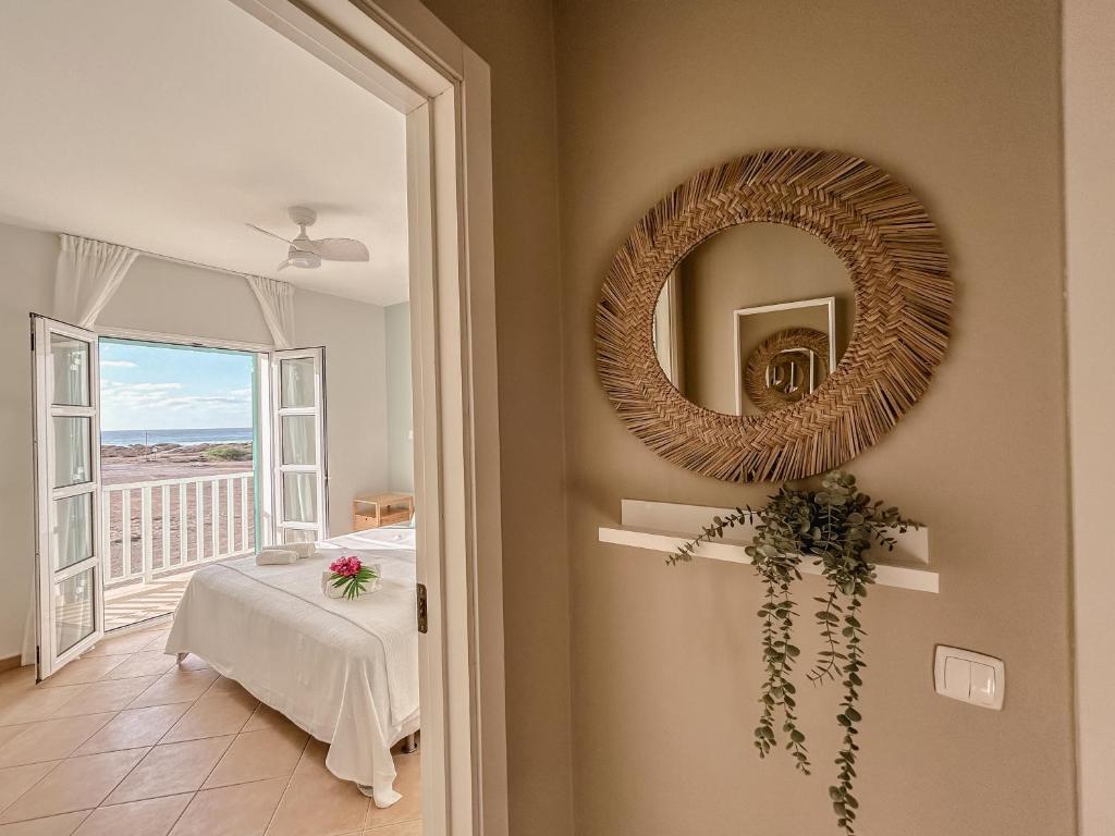 Postel nebo postele na pokoji v ubytování Papaya Apartments Boa Vista