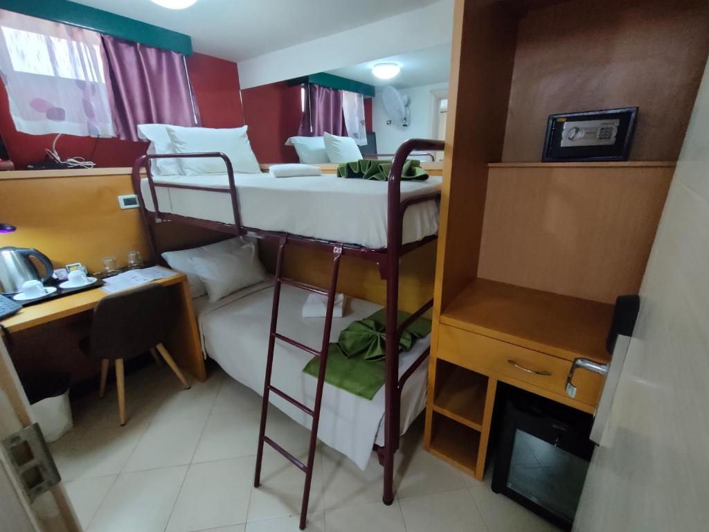 Postel nebo postele na pokoji v ubytování Hotel Belvedere Mindelo, Cabo Verde