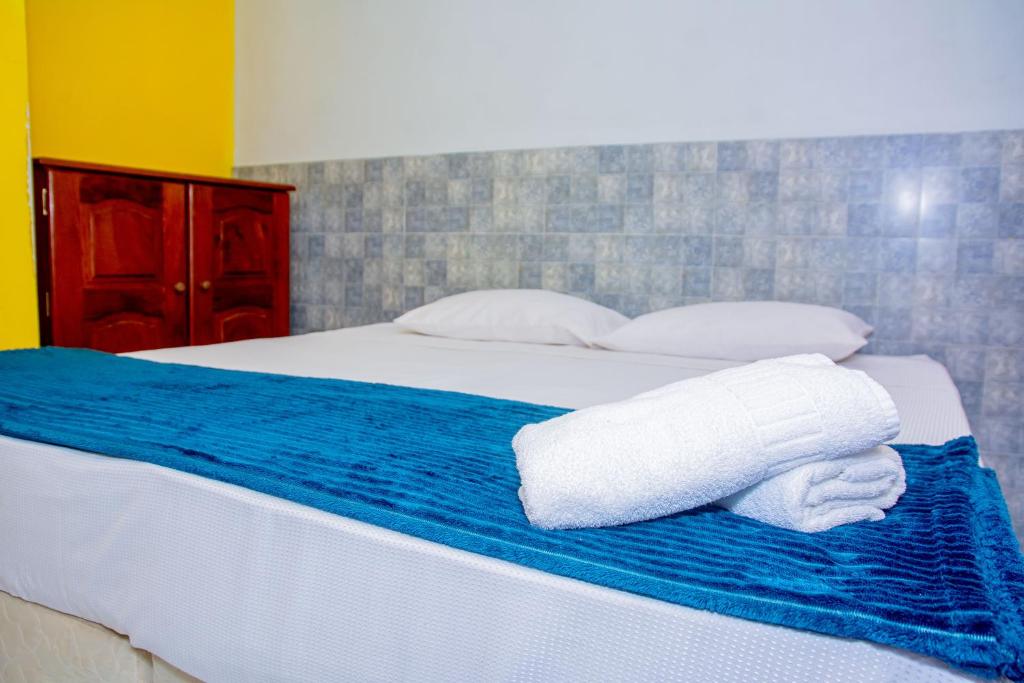 Una cama o camas en una habitación de Pousada Flat Castor