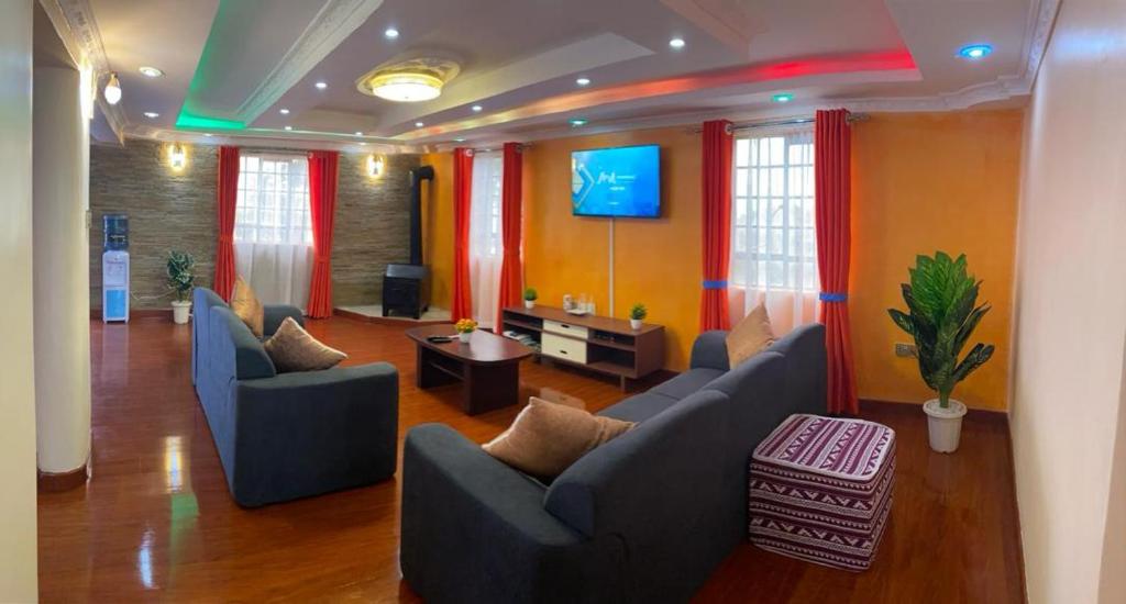 TV a/nebo společenská místnost v ubytování Kijabe Sunset View Guesthouse