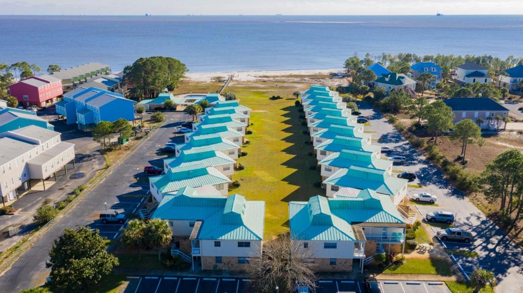an aerial view of a resort with blue roofs at Dauphin Island in Forney