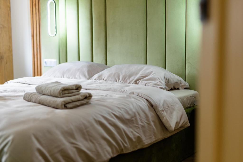 Кровать или кровати в номере Mazurskie lokum