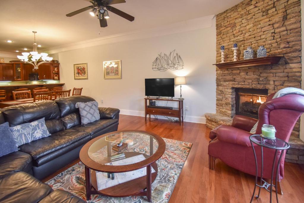 a living room with a couch and a fireplace at Lakeview Dreams in Young Harris