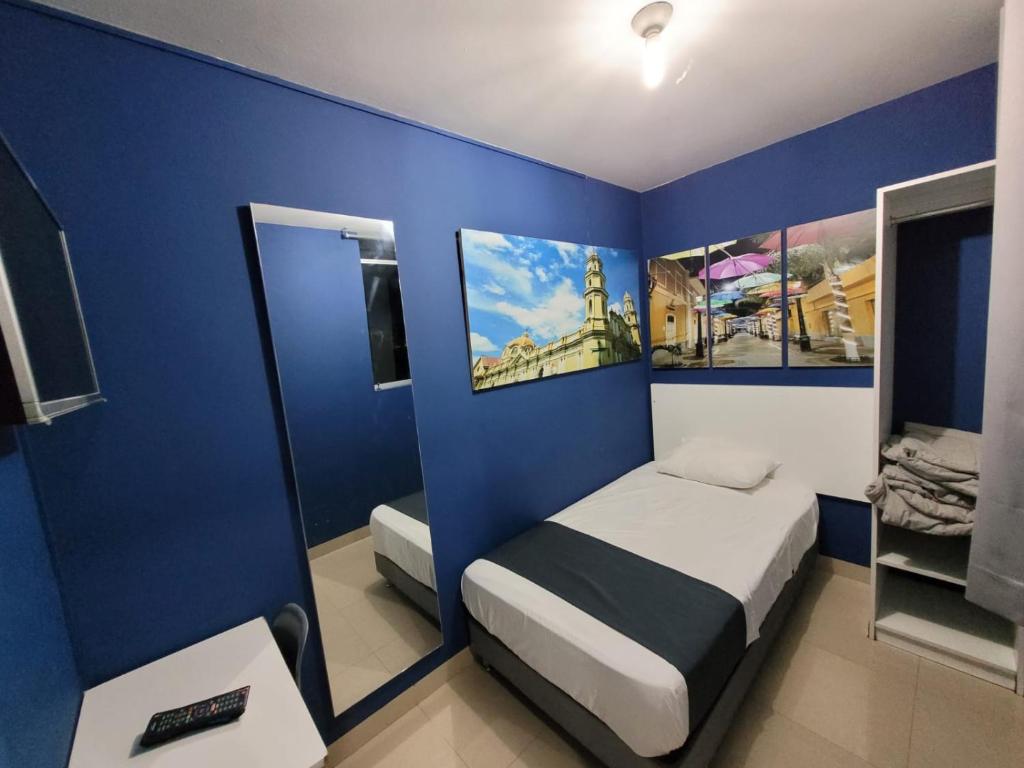 Llit o llits en una habitació de Conde Hotel Miraflores