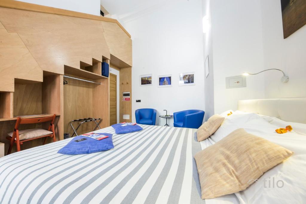 Postel nebo postele na pokoji v ubytování San Cosmo Suite