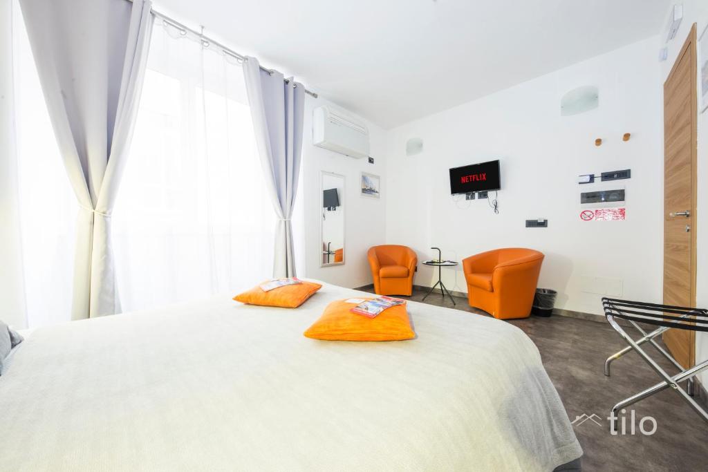 Postel nebo postele na pokoji v ubytování San Cosmo Suite