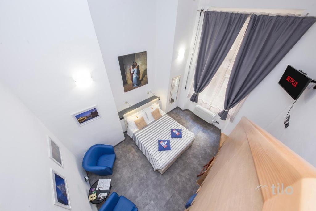Postel nebo postele na pokoji v ubytování San Cosmo Suite