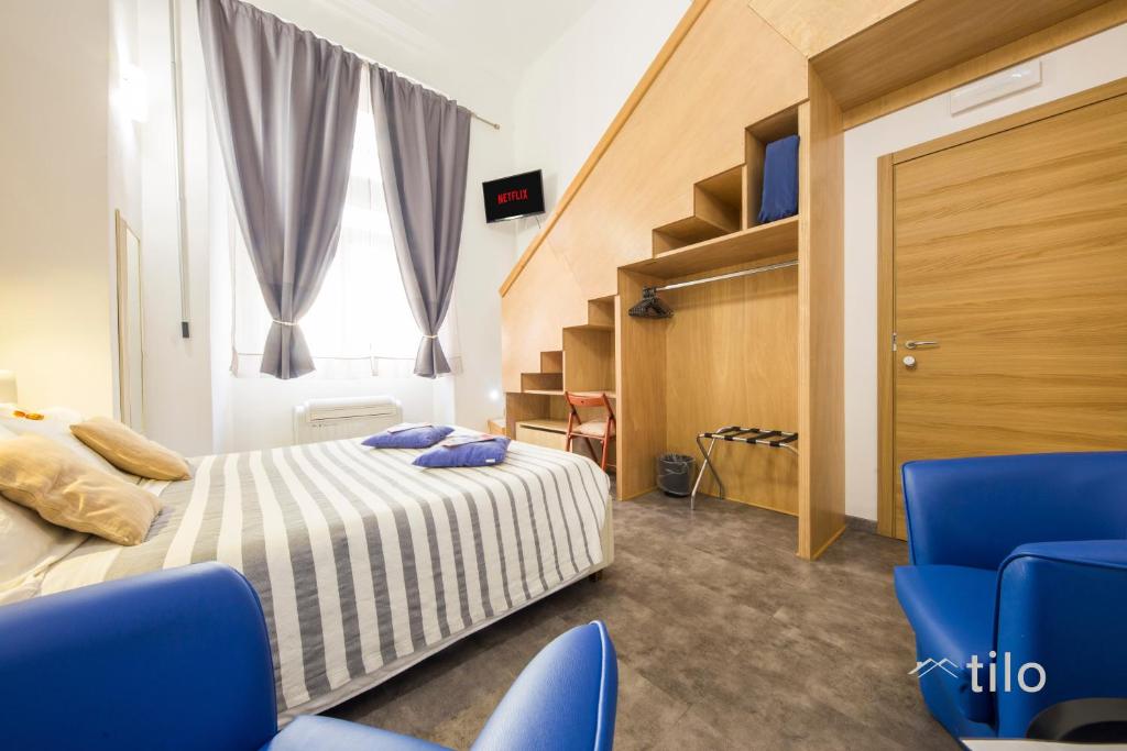 Postel nebo postele na pokoji v ubytování San Cosmo Suite