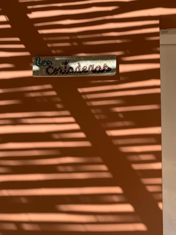 a shadow of a sign on a ceiling at Cabaña Cortaderas MI Campito Cachi Salta in Cachí