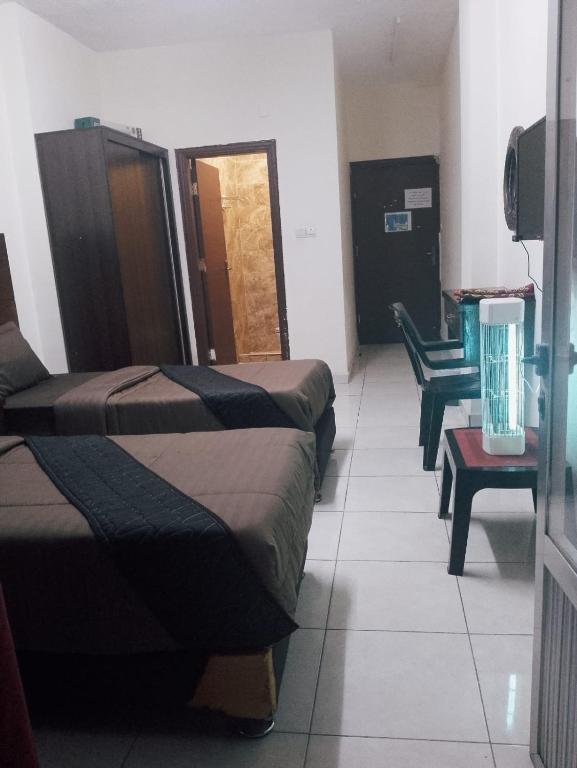 Ein Bett oder Betten in einem Zimmer der Unterkunft Amir Palace Hotel