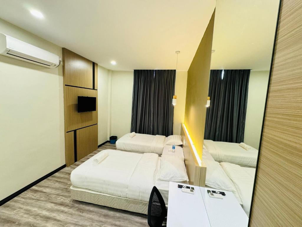 Postel nebo postele na pokoji v ubytování STAR HOTEL