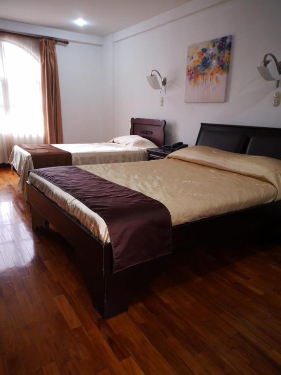 Postel nebo postele na pokoji v ubytování Hotel Plaza Real Suites & Apartments San Jose