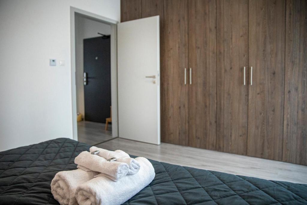 Postel nebo postele na pokoji v ubytování Kinga apartman