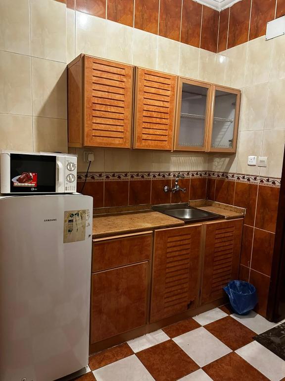 Kuchyň nebo kuchyňský kout v ubytování Elaf HotelSuits