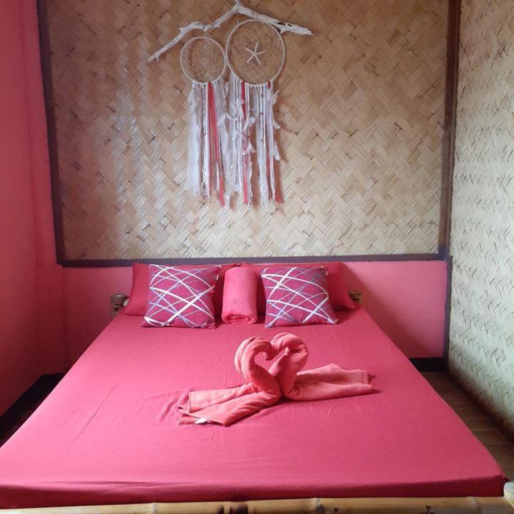 Postel nebo postele na pokoji v ubytování Rovi Homestay