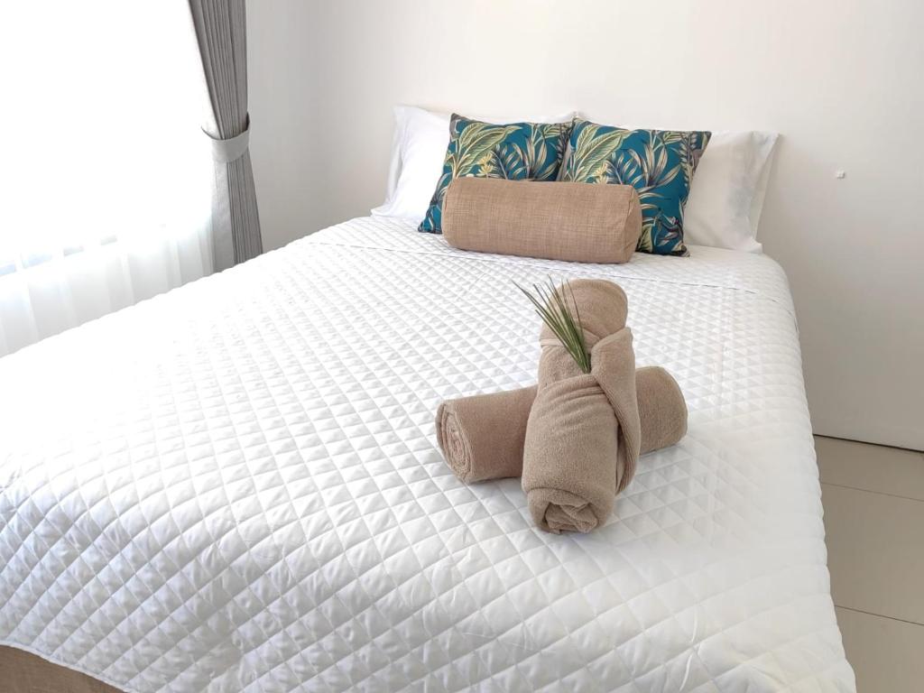 Łóżko lub łóżka w pokoju w obiekcie Apartamento Morpho Aeropuerto