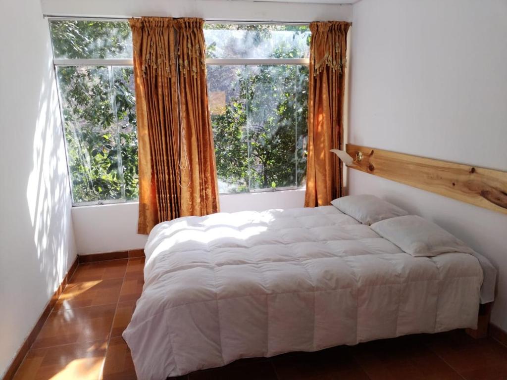Postel nebo postele na pokoji v ubytování Eden Lodge