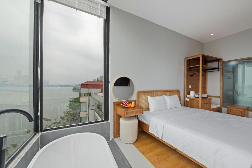 Postel nebo postele na pokoji v ubytování Lakeview Residence Hotel