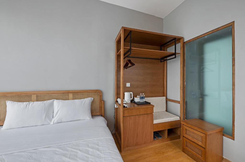 Postel nebo postele na pokoji v ubytování Lakeview Residence Hotel