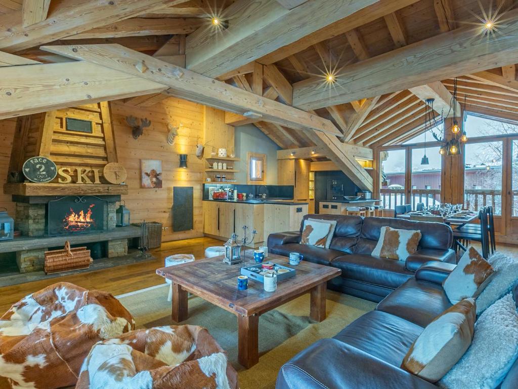 a living room with a couch and a table at Chalet Val-d'Isère, 5 pièces, 8 personnes - FR-1-694-14 in Val-d'Isère