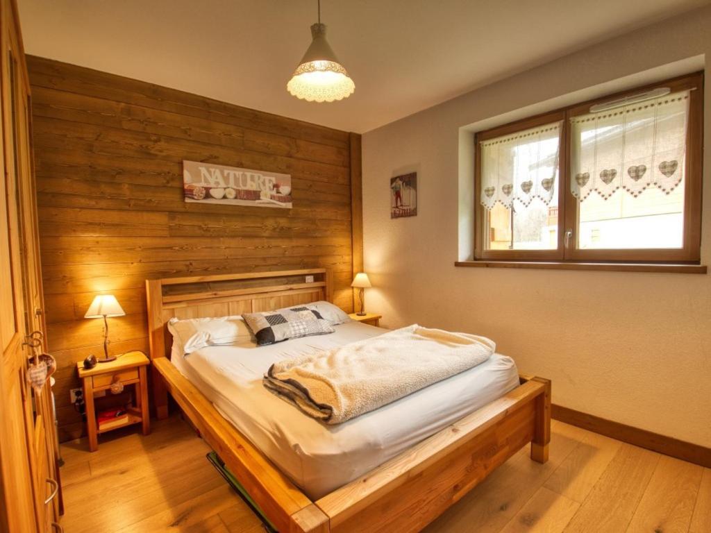 Cama ou camas em um quarto em Appartement Morillon Village, 3 pi&egrave;ces, 4 personnes - FR-1-642-88