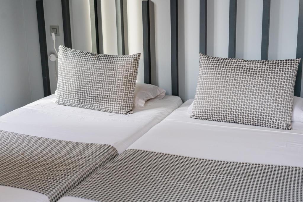 Postel nebo postele na pokoji v ubytování Hostal Carmen-Gran Vía