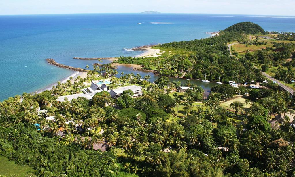 an aerial view of an island in the ocean at The Pearl South Pacific Resort, Spa & Golf Course in Pacific Harbour