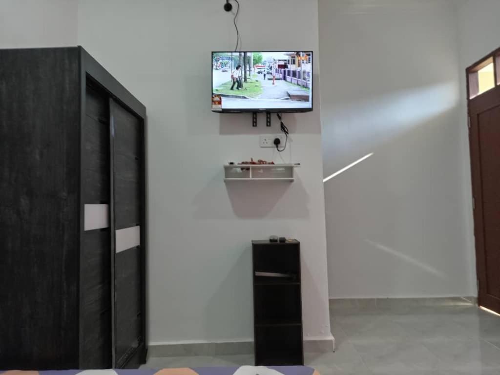 En tv och/eller ett underhållningssystem på KZ Roomstay