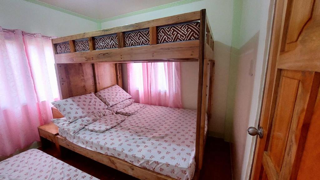 Postel nebo postele na pokoji v ubytování Mariden Resort & Homestay Siargao