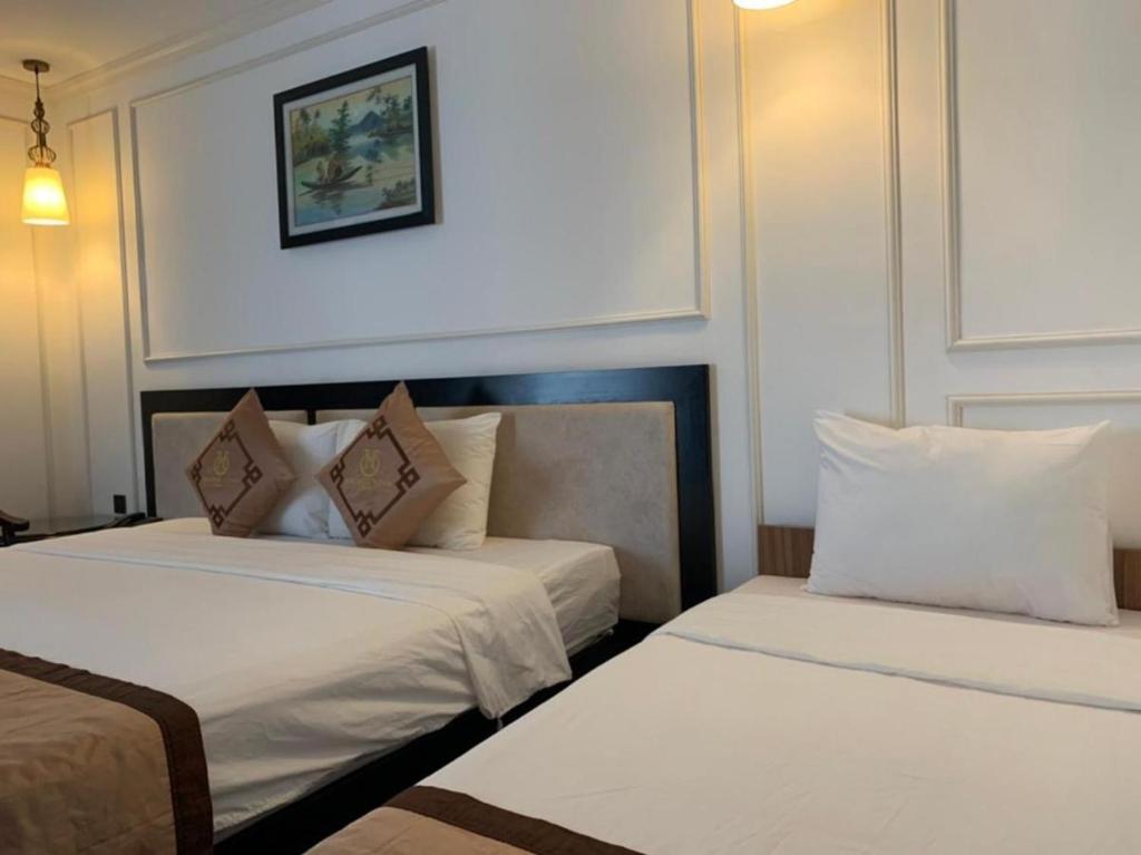 Postel nebo postele na pokoji v ubytování Coecco Xieng Khouang Hotel